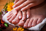 Woman's french manicure and pedicure 