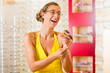 Young woman at optician with glasses