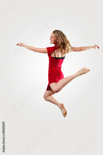 Photo: Young female dancer jumping Young female dancer jumping