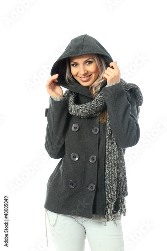 Photo: Blonde girl wearing a short gray coat with a long scarf Blonde girl wearing a short gray coat with a long scarf
