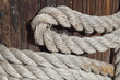 The hawser on the wooden post