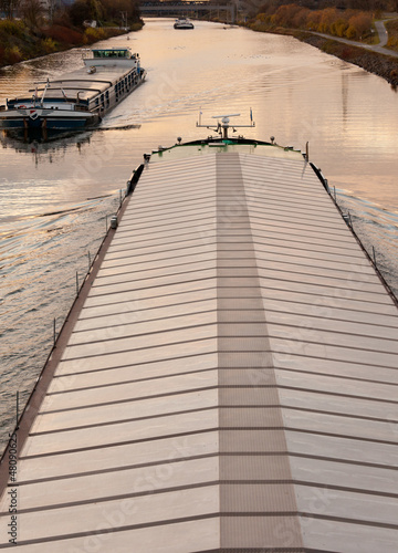 Photo: Barges plying waterway channel in industrial area Barges plying waterway channel in industrial area