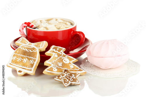 Photo: Cup of coffee with Christmas sweetness isolated on white Cup of coffee with Christmas sweetness isolated on white