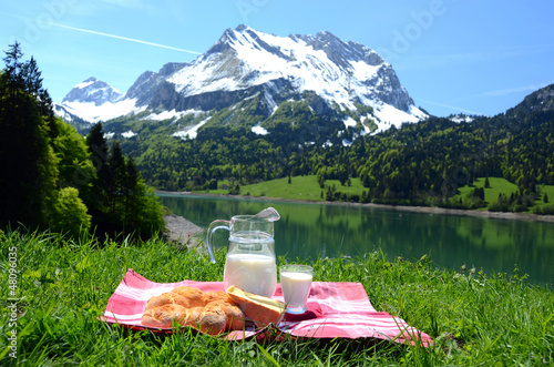 Photo: Milk, cheese and bread served at a picnic, Switzerland Milk, cheese and bread served at a picnic, Switzerland
