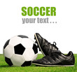 soccer ball and shoes in grass