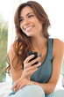 Woman Smiling And Holding Cell Phone