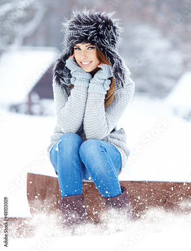 Photo: Attractive young woman in wintertime outdoor Attractive young woman in wintertime outdoor