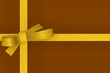 gold gift ribbon bow on brown background