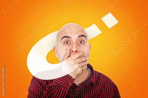 Photo: Man with hand on mouth hooked on questions Man with hand on mouth hooked on questions