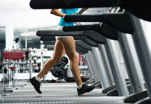 Photo: woman running on a treadmill woman running on a treadmill
