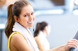 Happy people on treadmills in the gym
