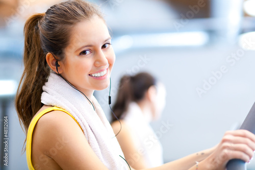Photo: Happy people on treadmills in the gym Happy people on treadmills in the gym