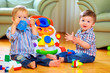 Photo: funny baby toddlers playing toys at home funny baby toddlers playing toys at home