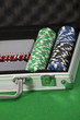 A photo of poker chips and cards in a briefcase