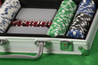 A photo of poker chips and cards in a briefcase