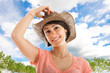 Woman holding her hat