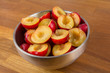 Photo: Bowl of halfed plums Bowl of halfed plums