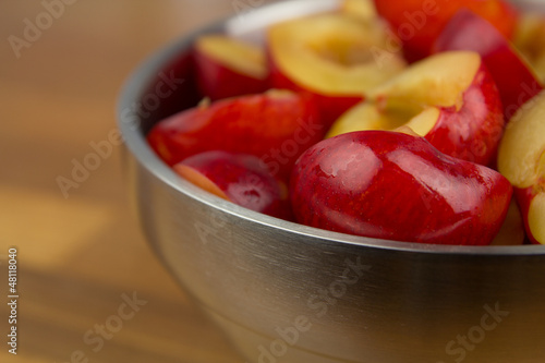 Photo: Bowl of halfed plums Bowl of halfed plums
