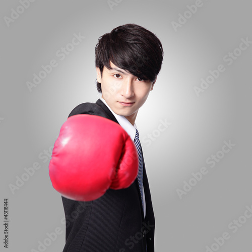 Photo: successful businessman with boxing gloves successful businessman with boxing gloves