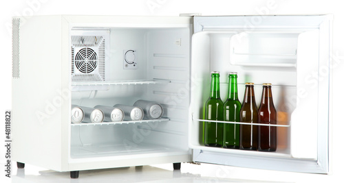Photo: mini fridge full of bottles and cans of beer isolated on white mini fridge full of bottles and cans of beer isolated on white