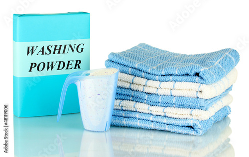 Photo: Box of washing powder with blue measuring cup and towels, Box of washing powder with blue measuring cup and towels,