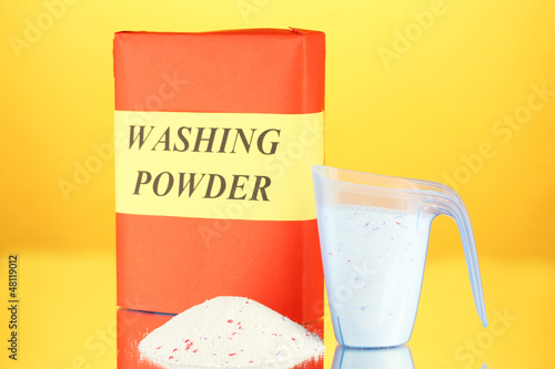 Photo: Box of washing powder with blue measuring cup, Box of washing powder with blue measuring cup,