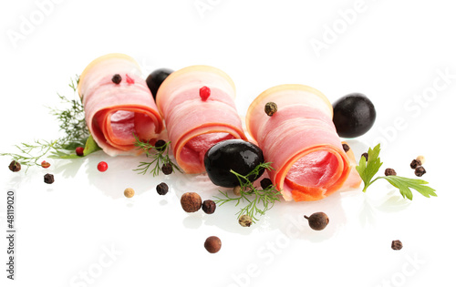 Photo: tasty bacon with olives and spices, isolated on white tasty bacon with olives and spices, isolated on white