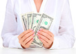 American dollars in a women hands, close up