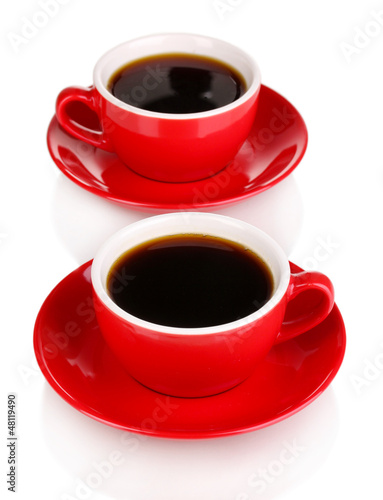 Photo: A red cups of strong coffee isolated on white A red cups of strong coffee isolated on white
