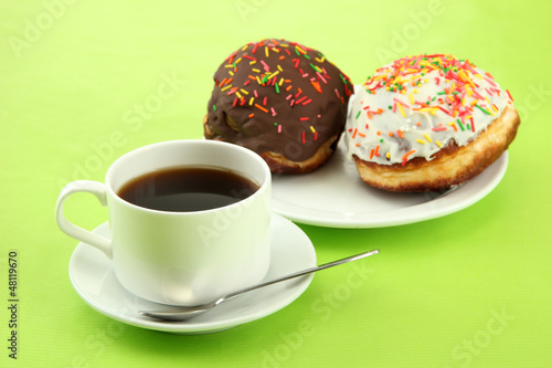 Photo: Tasty donuts on color plate on color background Tasty donuts on color plate on color background
