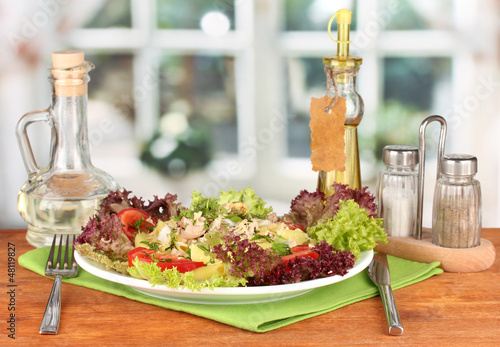 Photo: Tasty italian pasta with seafood on bright background Tasty italian pasta with seafood on bright background