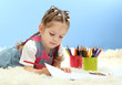 Photo: cute little girl playing with multicolor pencils, cute little girl playing with multicolor pencils,