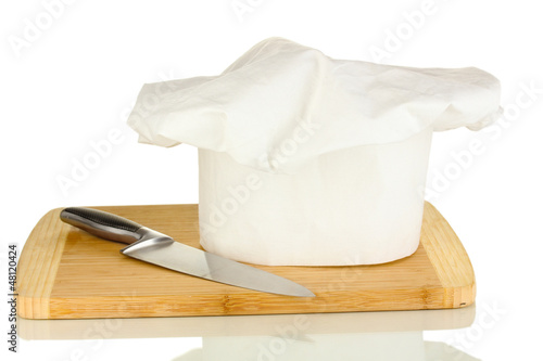 Photo: Chef's hat with knife isolated on white Chef's hat with knife isolated on white
