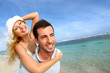 Cheerful couple enjoying vacation at the beach