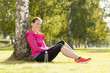 Happy woman jogger training in the park. Healthy lifestyle and p
