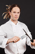 Photo: Handsome chef sharpening his knife Handsome chef sharpening his knife
