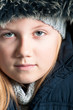 Winter child wearing a fur hat