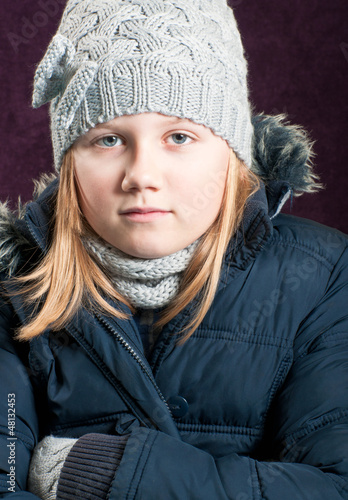 Photo: Cold child in winter clothing Cold child in winter clothing