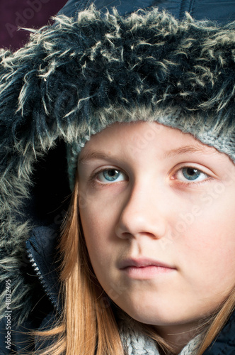 Photo: Girl in winter clothing Girl in winter clothing