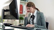 Tired businesswoman having headache in the office
