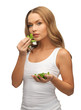 woman with spinach leaves on palms