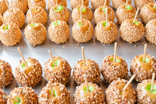 Photo: Batch of caramel apples with nuts Batch of caramel apples with nuts