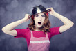 Redhead housewife with colander over head
