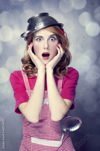 Photo: Redhead housewife with soup ladle Redhead housewife with soup ladle