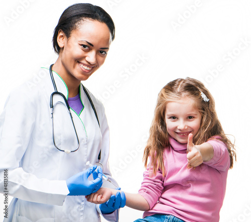 Photo: Doctor doing vaccine injection to a child Doctor doing vaccine injection to a child