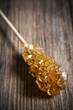 Sugar sticks isolated on wooden background