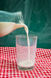 Photo: Pouring milk in glass Pouring milk in glass