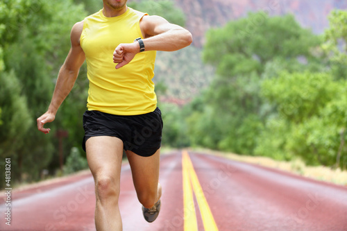 Photo: Running with heart rate monitor sports watch Running with heart rate monitor sports watch
