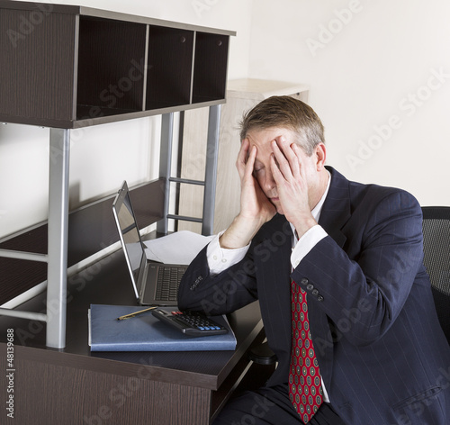 Photo: Mature Man Feeling the Pressure of the Income Tax Season Mature Man Feeling the Pressure of the Income Tax Season