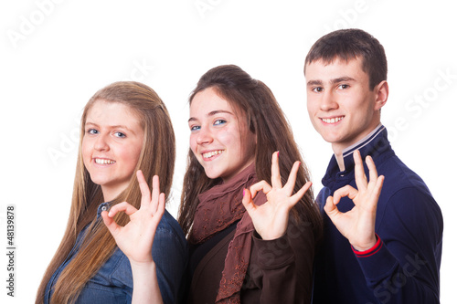 Photo: Teenage Students Making Ok Sign Teenage Students Making Ok Sign